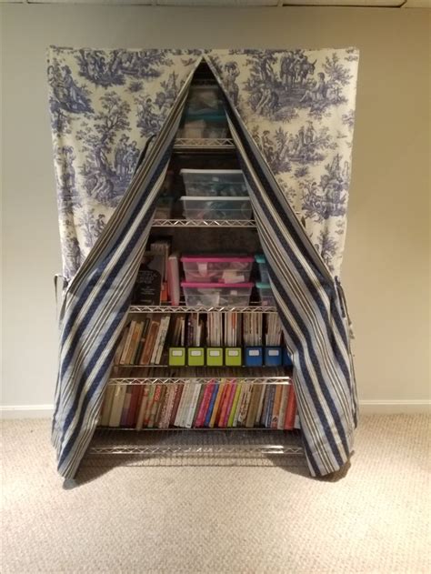 how to disguise metal shelving with fabric|how to hide cluttered bookshelves.